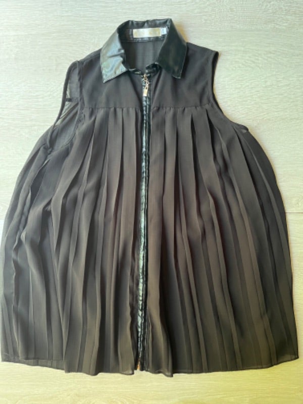 Blouse sans manche à fermeture femme